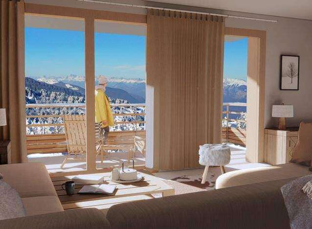Experience breathtaking mountain views from this cozy living space.