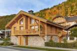Discover the charm of this stunning wooden chalet, perfectly nestled in a picturesque mountain setting.