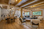 Experience rustic charm in this stunning property featuring exposed wooden beams and a cozy living space.