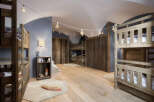 This charming bedroom features rustic wooden bunk beds, perfect for a cozy and inviting space.