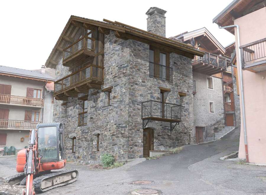 Discover the charm of this stone-built property, featuring traditional wooden balconies that add character.