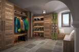 This ski storage room is the perfect blend of rustic charm and modern functionality.