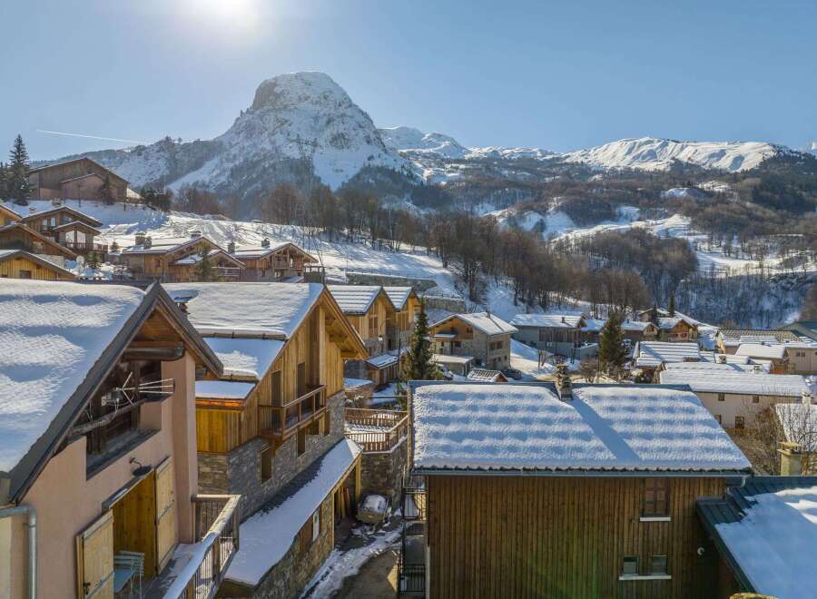 Discover the charm of this stunning mountain village, nestled amidst snow-capped peaks.