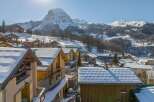 Discover the charm of this stunning mountain village, nestled amidst snow-capped peaks.