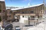 Discover your dream alpine retreat! This stunning property boasts a modern design with a cozy, wooden exterior.