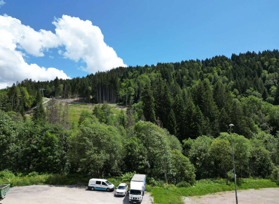 Discover a stunning property nestled amidst lush greenery and breathtaking mountain views.
