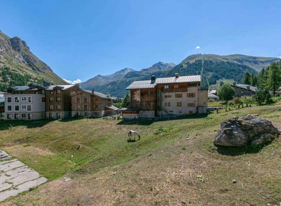 This charming chalet offers breathtaking mountain views and is nestled in a peaceful village setting.