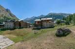 This charming chalet offers breathtaking mountain views and is nestled in a peaceful village setting.