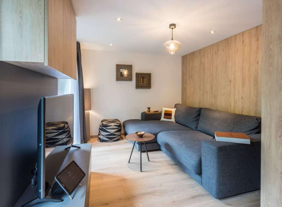 This stylish living space features a modern gray sectional sofa, perfect for relaxing.