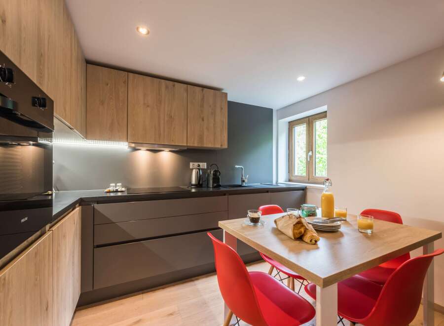 This modern kitchen boasts sleek cabinetry and a stylish design.