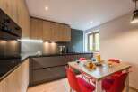 This modern kitchen boasts sleek cabinetry and a stylish design.