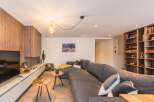 This modern living room features a stylish gray sectional sofa, perfect for relaxing.