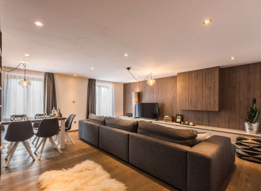 This stunning living space boasts a modern design with a cozy atmosphere.