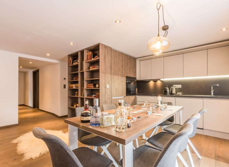 This stunning property boasts a modern kitchen with sleek cabinetry and top-of-the-line appliances.