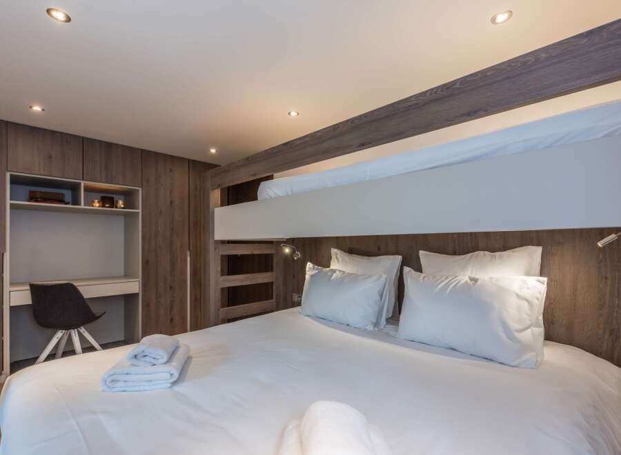 This cozy bedroom features a bunk bed, perfect for families or groups.