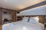 This cozy bedroom features a bunk bed, perfect for families or groups.