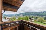 Enjoy breathtaking mountain views from this charming balcony.