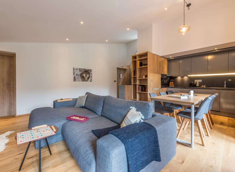 This modern living space features a comfortable gray sectional sofa, perfect for relaxing.