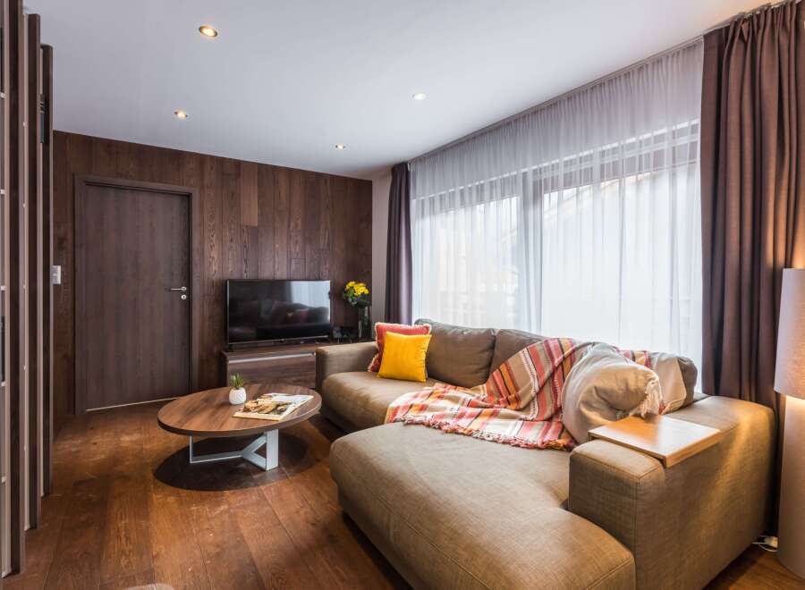 This cozy living space features a stylish sectional sofa, perfect for relaxing.