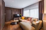 This cozy living space features a stylish sectional sofa, perfect for relaxing.