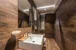 Step into a luxurious bathroom with stunning wood-look tile, creating a warm and inviting atmosphere.