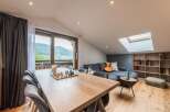 This stunning living space boasts a modern design with a touch of rustic charm.