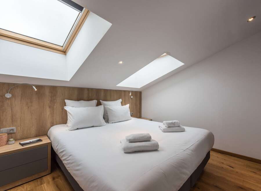 Discover a cozy bedroom retreat with a modern design.