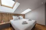 Discover a cozy bedroom retreat with a modern design.