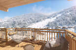 Enjoy breathtaking mountain views from this luxurious ski chalet.