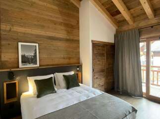 Experience rustic charm in this cozy bedroom.