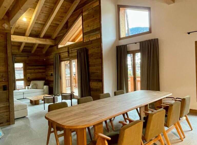 Experience rustic elegance in this stunning property, featuring exposed wooden beams and a cozy ambiance.
