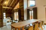 Experience rustic elegance in this stunning property, featuring exposed wooden beams and a cozy ambiance.