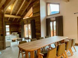 Experience rustic elegance in this stunning property, featuring exposed wooden beams and a cozy ambiance.