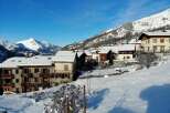 Discover a charming winter escape in this picturesque village nestled amidst snow-capped mountains.