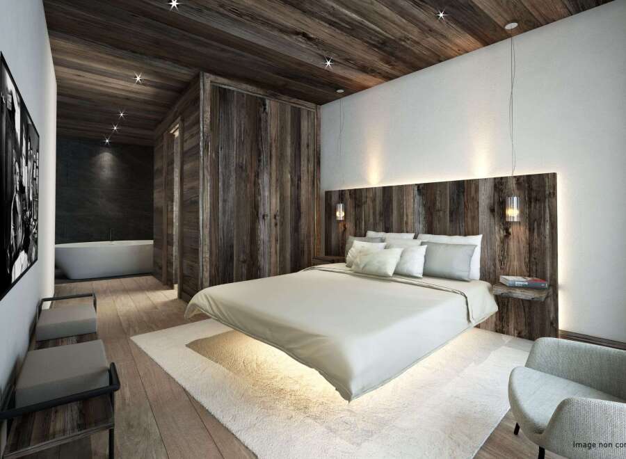 Experience luxury in this stunning bedroom featuring a unique floating bed design.