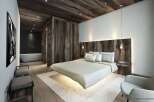 Experience luxury in this stunning bedroom featuring a unique floating bed design.