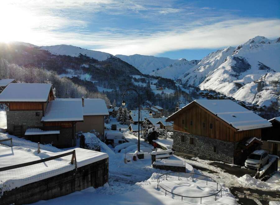 Experience the charm of a snow-covered village nestled in the heart of the mountains.