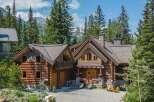 Escape to your dream mountain retreat! This stunning log cabin boasts a charming exterior with a rustic design.