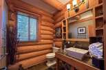 Step into rustic elegance with this stunning log cabin bathroom.