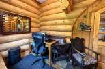 Step into rustic charm with this cozy log cabin home office.