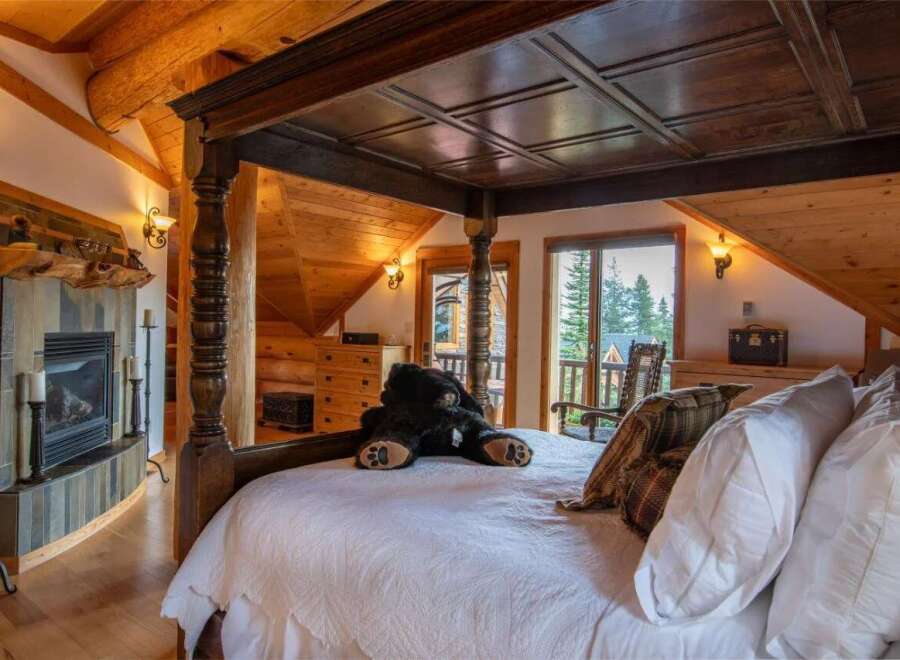 Experience rustic luxury in this stunning bedroom.