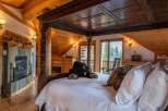 Experience rustic luxury in this stunning bedroom.