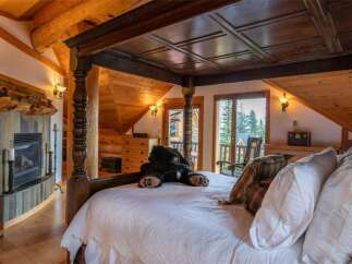 Experience rustic luxury in this stunning bedroom.