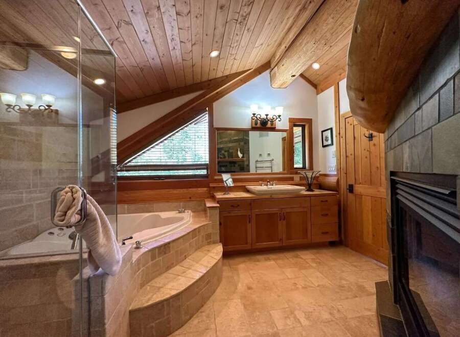 Experience rustic luxury in this stunning bathroom.