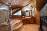 Experience rustic luxury in this stunning bathroom.