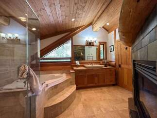 Experience rustic luxury in this stunning bathroom.