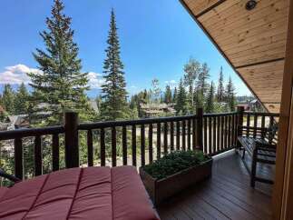Enjoy breathtaking mountain views from this stunning balcony.