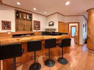 Discover the charm of this stunning property, featuring a unique bar area perfect for entertaining.