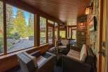 Experience the tranquility of this stunning property, featuring a sunroom with expansive windows that frame breathtaking views of the surrounding nature.