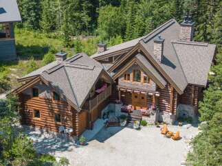 Discover the charm of this stunning log cabin home nestled in a serene, wooded setting.